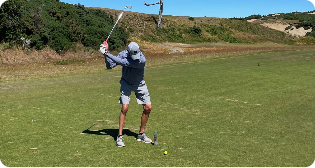 Man playing golf.